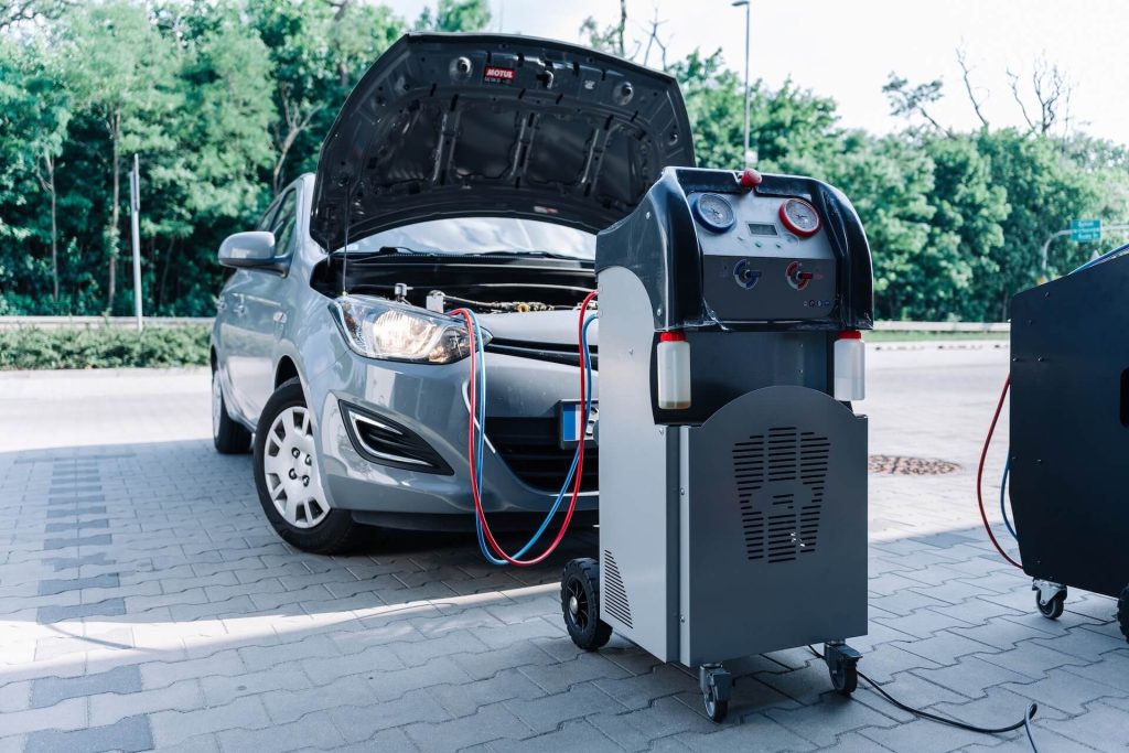 Why is my car AC blowing warm air