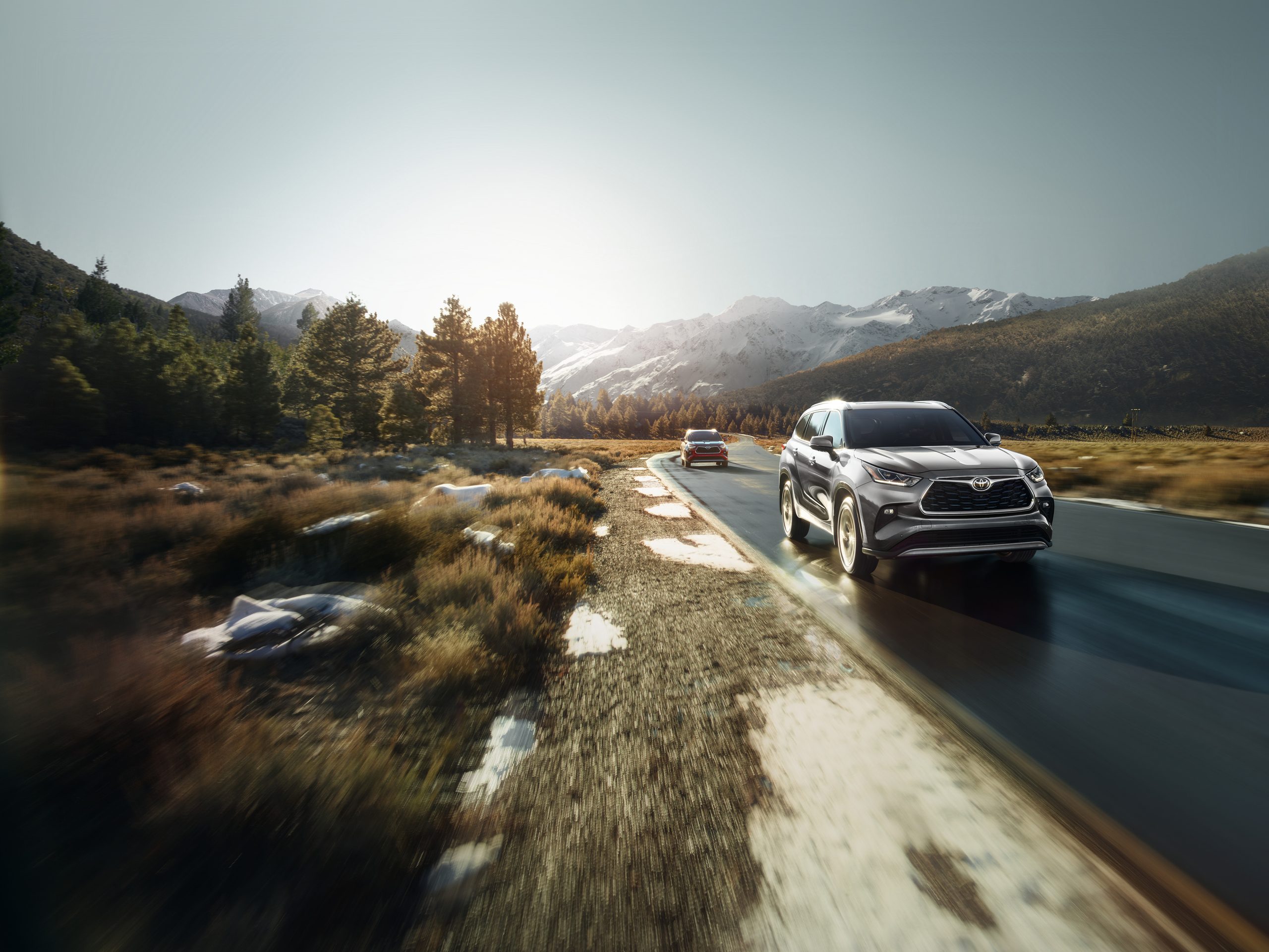 2026 Toyota Highlander driving on a road