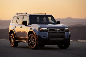 2027 Toyota Land Cruiser in blue parked at sunset highlighting rugged exterior