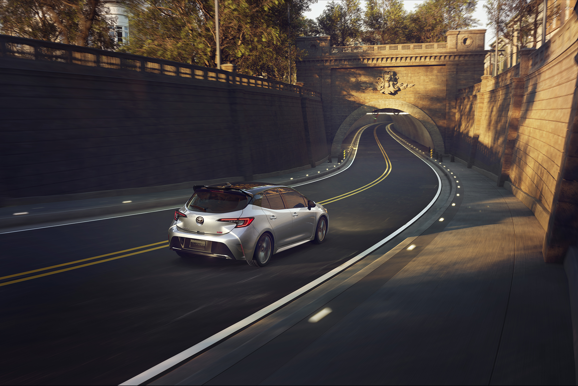 2027 Toyota Corolla Hatchback driving on a highway road